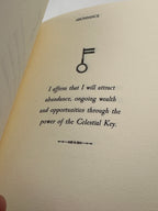 BOOK - THE CELESTIAL KEY + 3 WOODEN TALISMANS